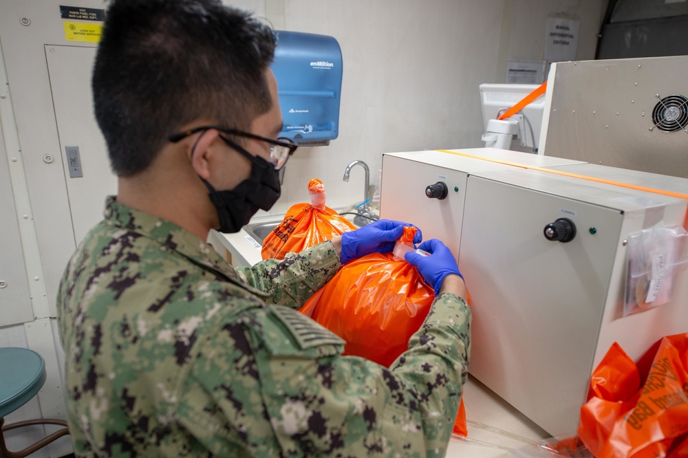 USNS Mercy Sailors Handle Hazardous Waste