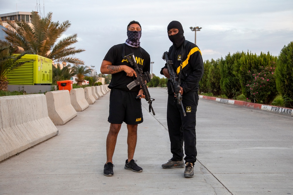 Deployed service members wear improvised face masks