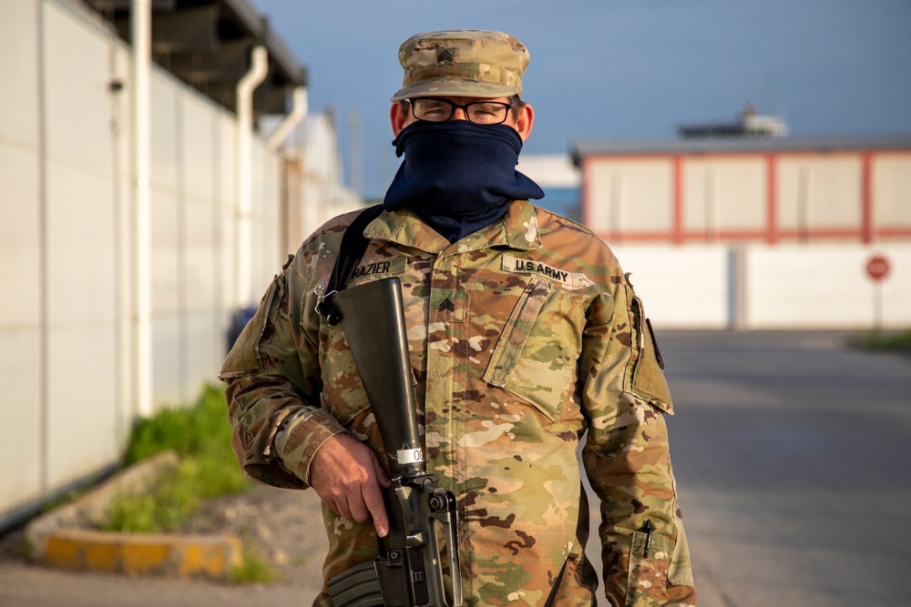 Deployed service members wear improvised face masks