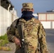 Deployed service members wear improvised face masks