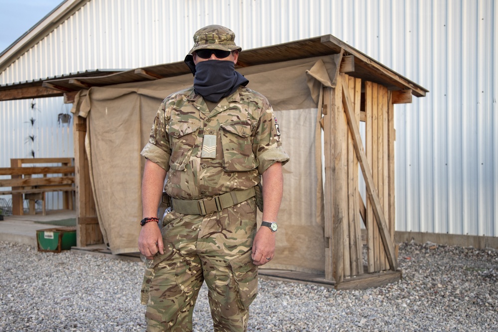 Deployed service members wear improvised face masks