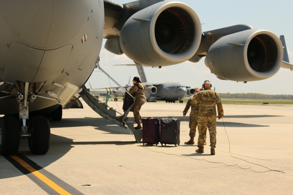 305th Aerial Port Squadron load up baggage at JBMDL