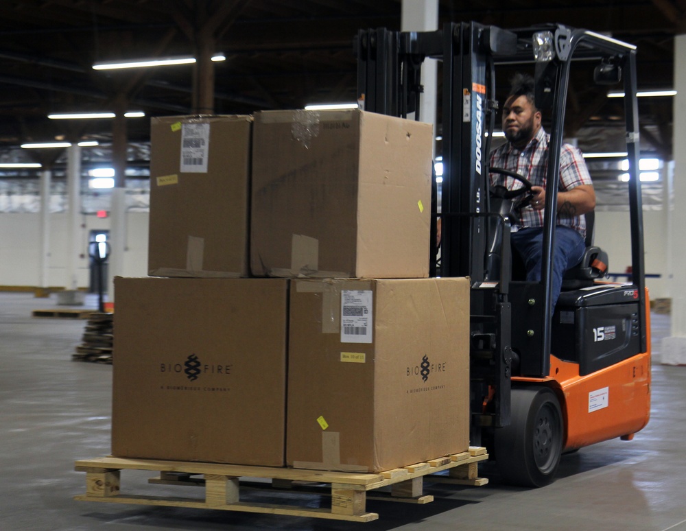 Sierra Army Depot forklift driver moving PPE