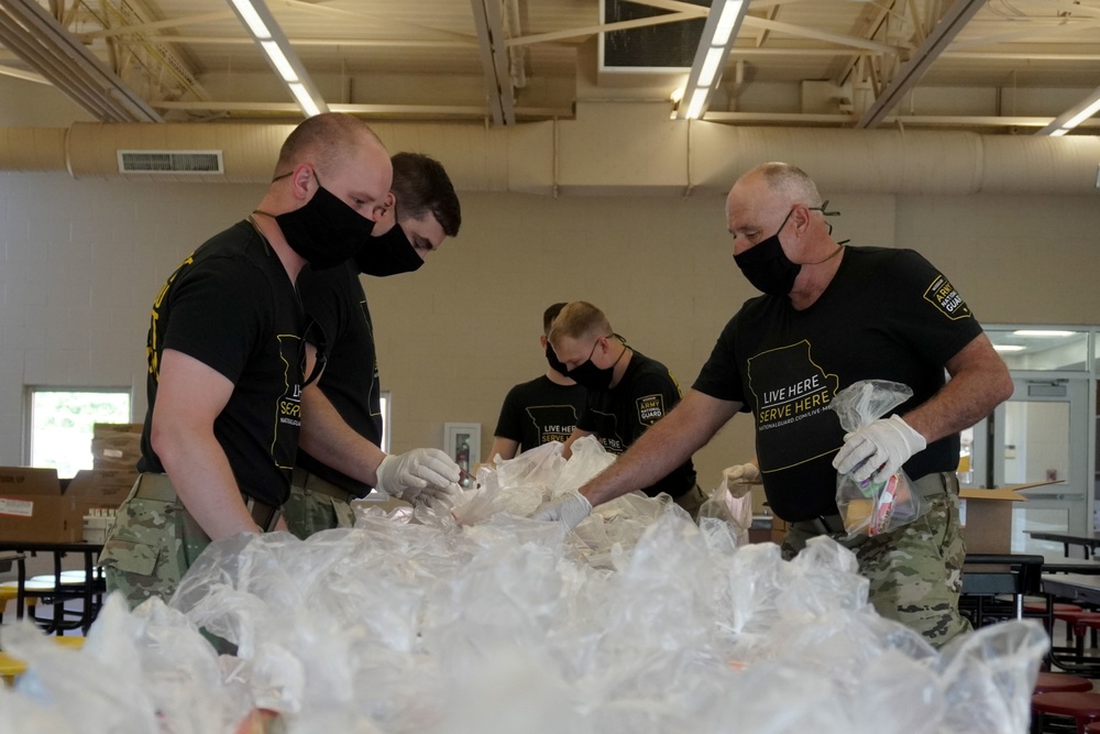 Soldiers help serve school lunches