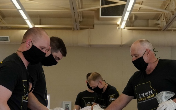 Soldiers help serve school lunches