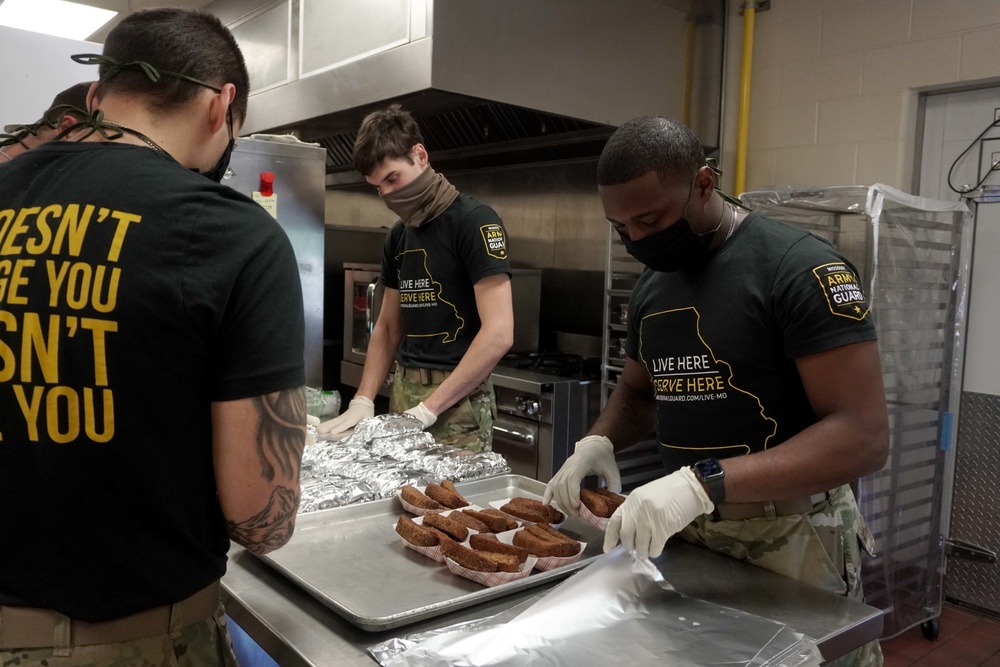 Soldiers help serve school lunches
