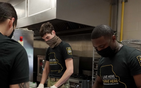 Soldiers help serve school lunches