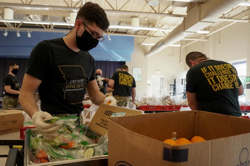 Soldiers help serve school lunches