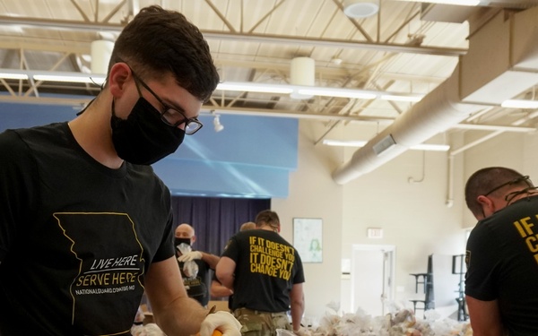 Soldiers help serve school lunches