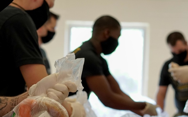 Soldiers help serve school lunches