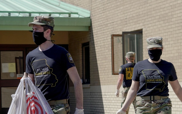 Soldiers help serve school lunches