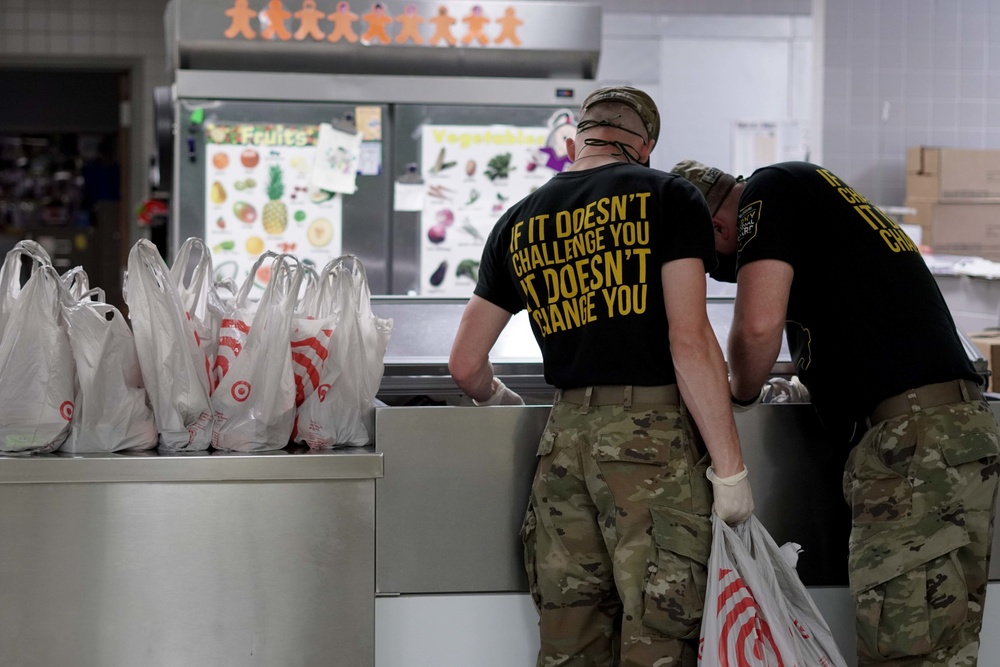 Soldiers help serve school lunches