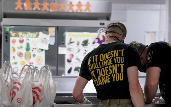 Soldiers help serve school lunches