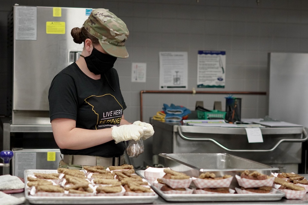 Soldiers help serve school lunches