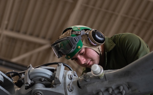 Sailor performs maintenance on MH-60S Sea Hawk