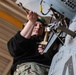 Sailor performs maintenance on MH-60S Sea Hawk