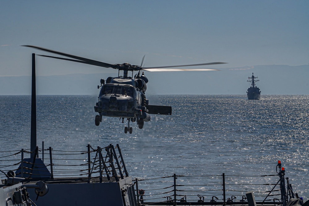 MH-60R Seahawk helicopter prepares to land aboard USS Halsey (DDG 97)