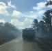 U.S. Navy Seabees with NMCB-5’s Detail Tinian help fight a local brushfire