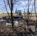 U.S. Navy Seabees with NMCB-5’s Detail Tinian help fight a local brushfire