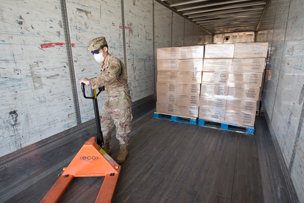 Members from the 150th Mission Support Group work to complete another food delivery mission in Santa Fe, N.M.