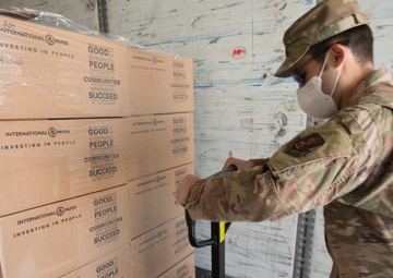 Members from the 150th Mission Support Group work to complete another food delivery mission in Santa Fe, N.M.