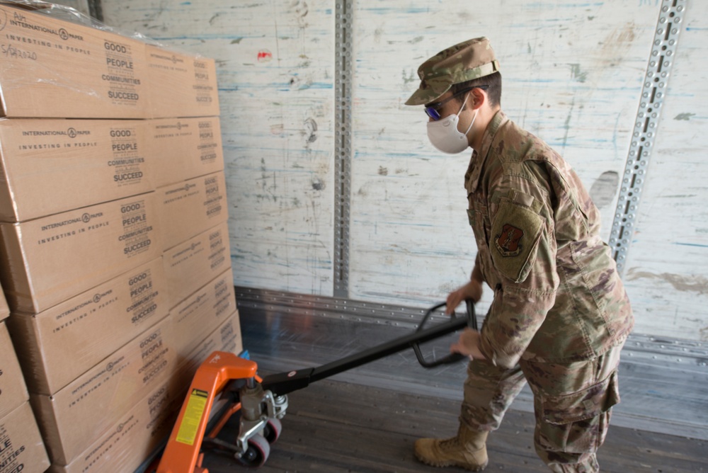 Members from the 150th Mission Support Group work to complete another food delivery mission in Santa Fe, N.M.