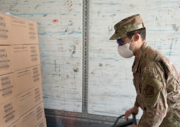 Members from the 150th Mission Support Group work to complete another food delivery mission in Santa Fe, N.M.