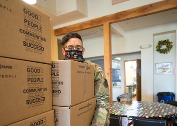Members from the 150th Mission Support Group work to complete another food delivery mission in Santa Fe, N.M.