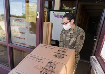 Members from the 150th Mission Support Group work to complete another food delivery mission in Santa Fe, N.M.