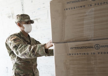 Members from the 150th Mission Support Group work to complete another food delivery mission in Santa Fe, N.M.