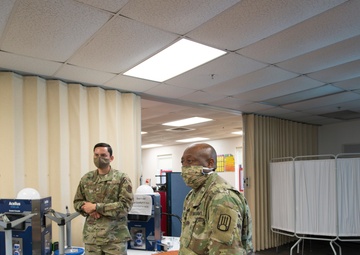 Airmen in the New Mexico National Guard patrol an alternate care site in Shiprock, N.M. 
