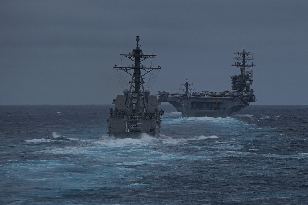 USS Ralph Johnson (DDG 114) and USS Nimitz (CVN 68) transit the Pacific Ocean