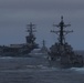 USS Ralph Johnson (DDG 114) and USS Sterret (DDG 104) transit the Pacific with aircraft carrier USS Nimitz (CVN 68)