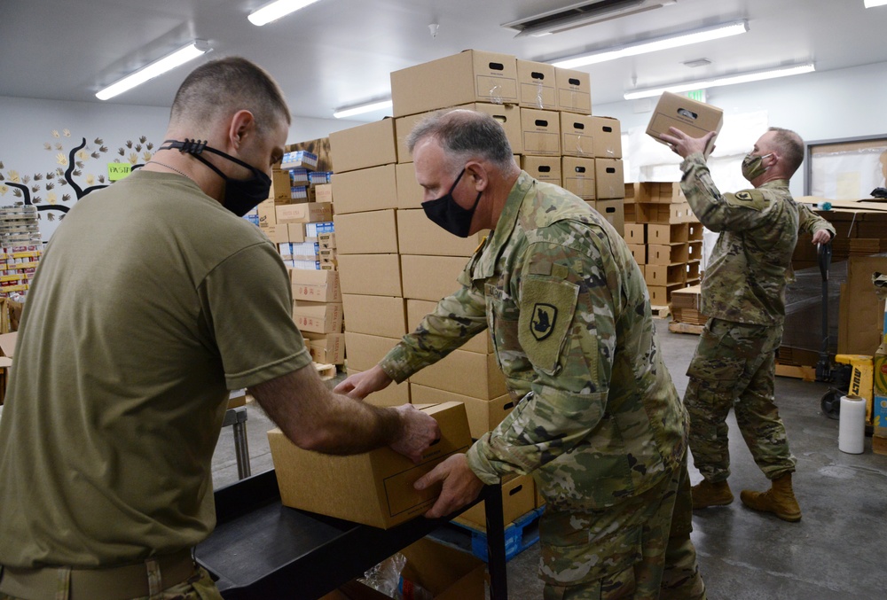 U.S. Congressman Rep. Rick Larsen visits Guardsmen at Sedro-Woolley Food Bank.