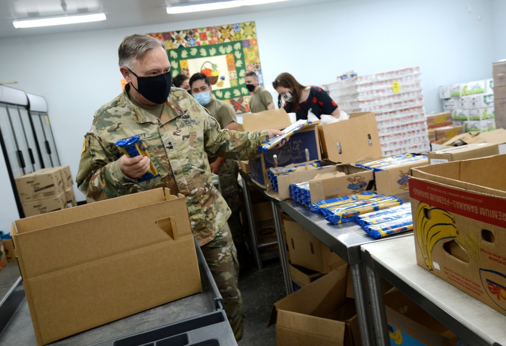 U.S. Congressman Rep. Rick Larsen visits Guardsmen at Sedro-Woolley Food Bank.