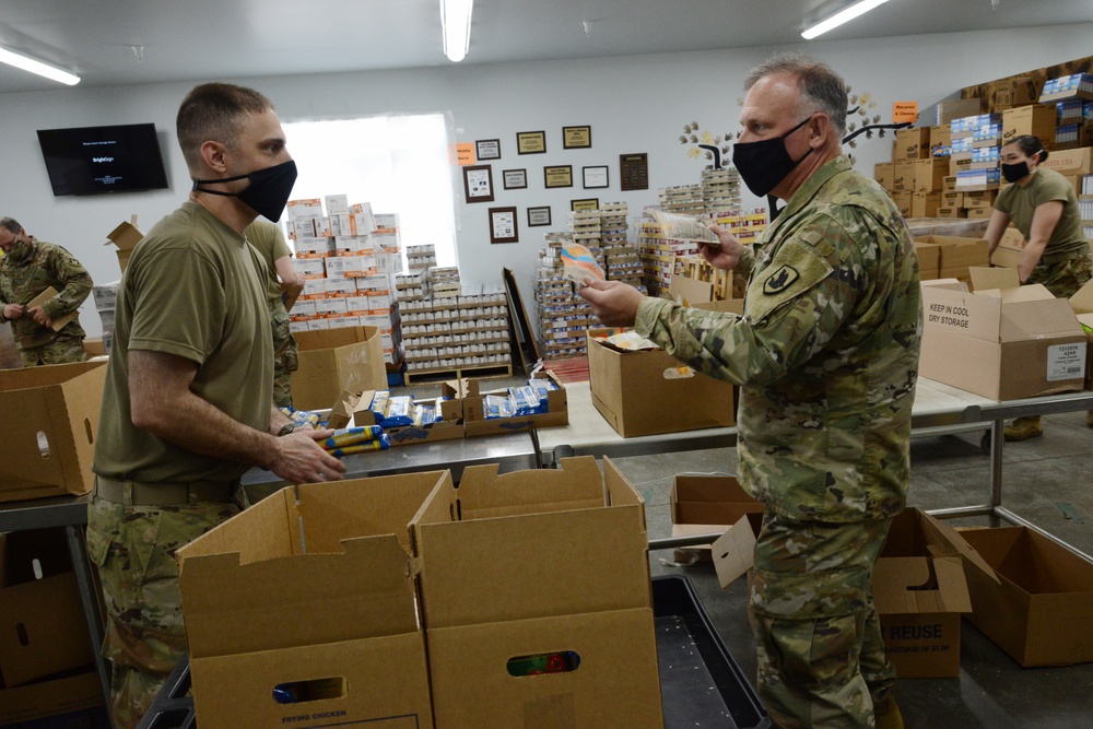 U.S. Congressman Rep. Rick Larsen visits Guardsmen at Sedro-Woolley Food Bank.