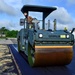U.S. Navy Seabees with NMCB-5 place asphalt for Marine Air Control Squadron 4