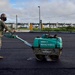 U.S. Navy Seabees with NMCB-5 place asphalt for Marine Air Control Squadron 4