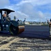 U.S. Navy Seabees with NMCB-5 place asphalt for Marine Air Control Squadron 4