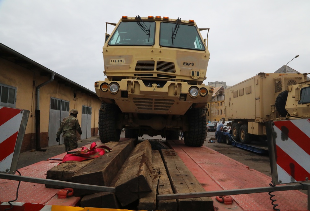 1ID FWD soldiers load vehicles for transit to Fort Riley