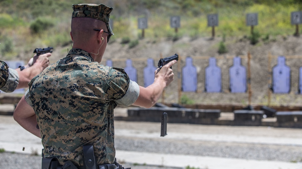PMO trains new security augment force Marines in pistol marksmanship