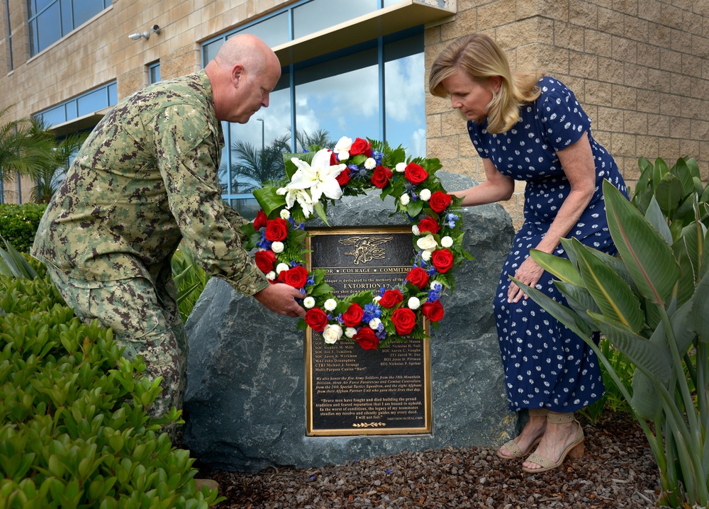 Naval Special Warfare Force Master Chief (SEAL) Bill King and his wife Robin lay a wreath on the Extortion 17 Memorial in observance of Memorial Day