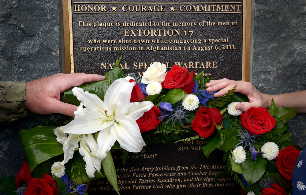 Naval Special Warfare Force Master Chief (SEAL) Bill King and his wife Robin lay a wreath on the Extortion 17 Memorial in observance of Memorial Day at the Naval Special Warfare Command Headquarters.