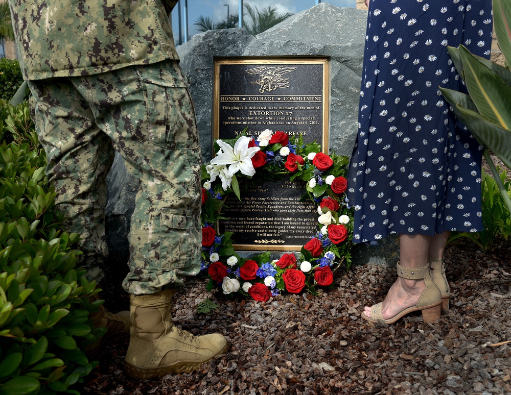 Naval Special Warfare Force Master Chief (SEAL) Bill King and his wife Robin lay a wreath on the Extortion 17 Memorial in observance of Memorial Day at the Naval Special Warfare Command Headquarters