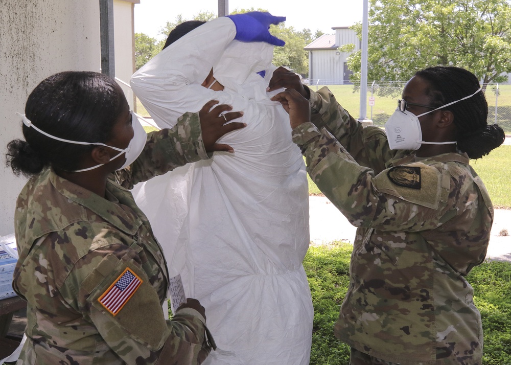 249th Transportation Company Soldiers train Joint Task Force 176 disinfection teams in proper use of PPE