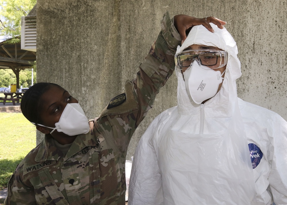 249th Transportation Company Soldiers train Joint Task Force 176 disinfection teams in proper use of PPE