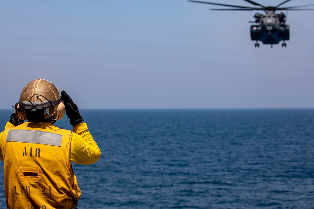 Sailors take part in flight operations.