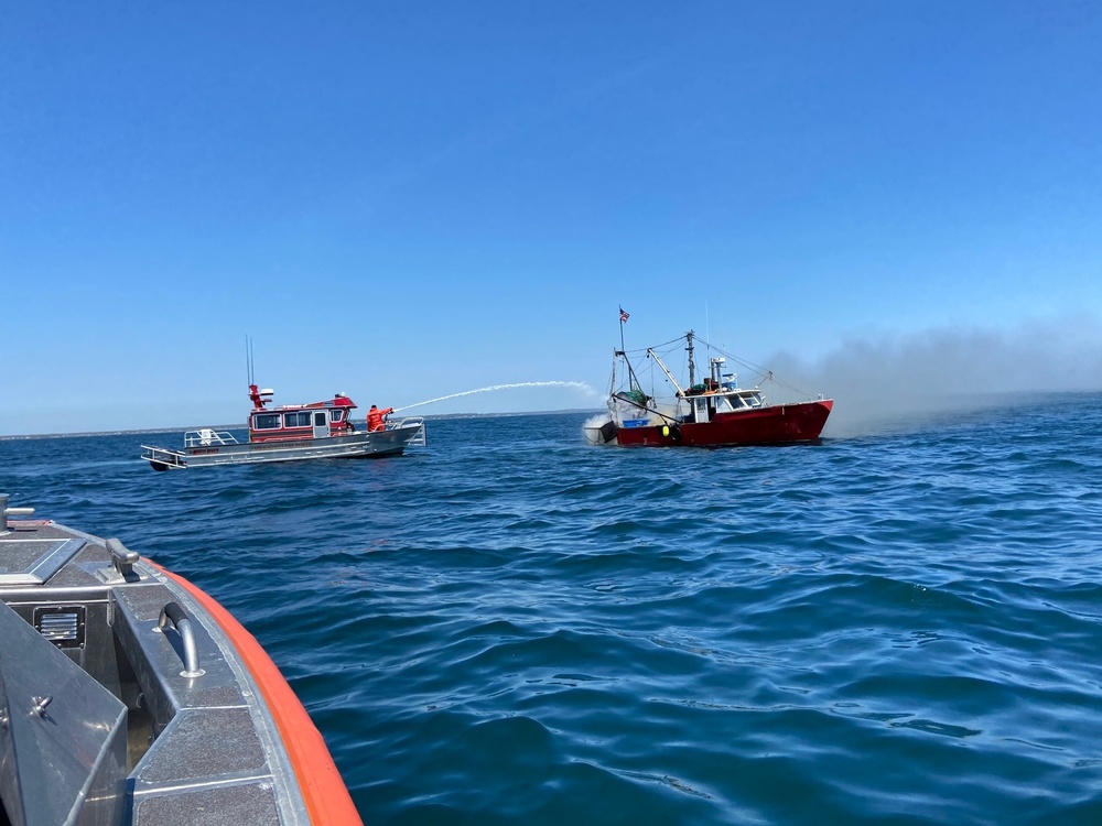 Coast Guard rescues 3 from boat fire