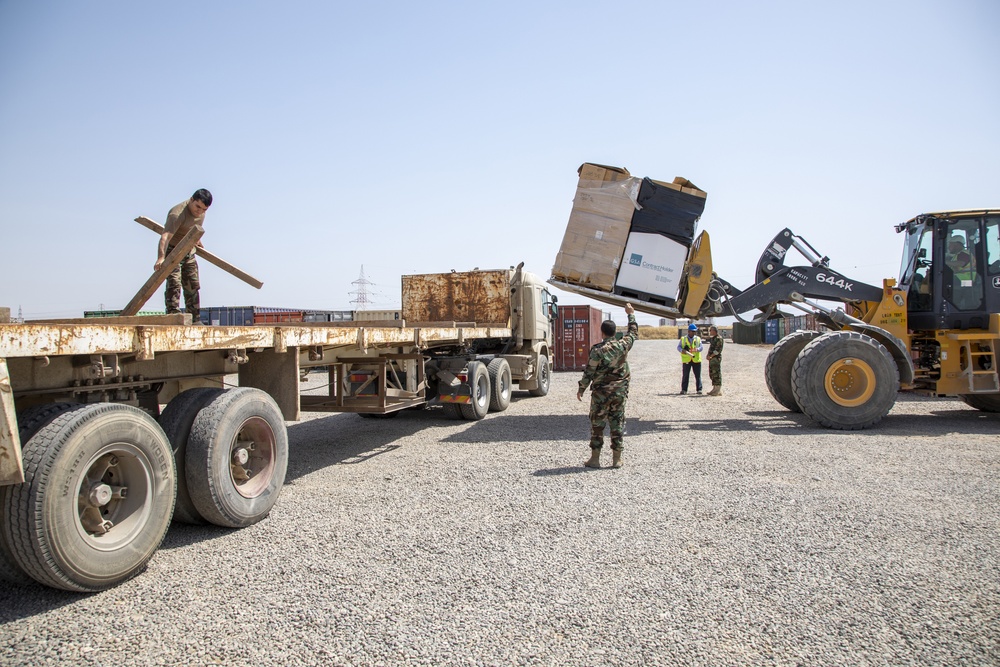 Coalition forces divest uniforms and concertina wire to Peshmerga forces
