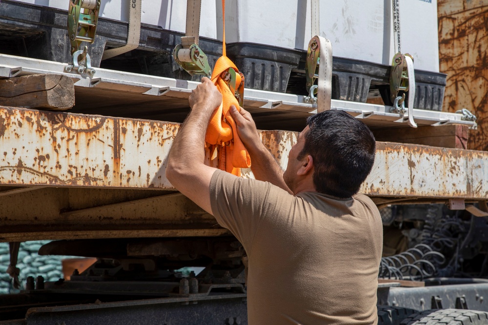 Coalition forces divest uniforms and concertina wire to Peshmerga forces